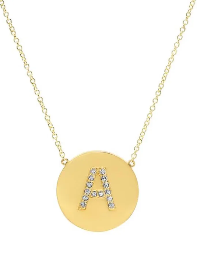 Diamond letter set in 14k matte gold disk necklace