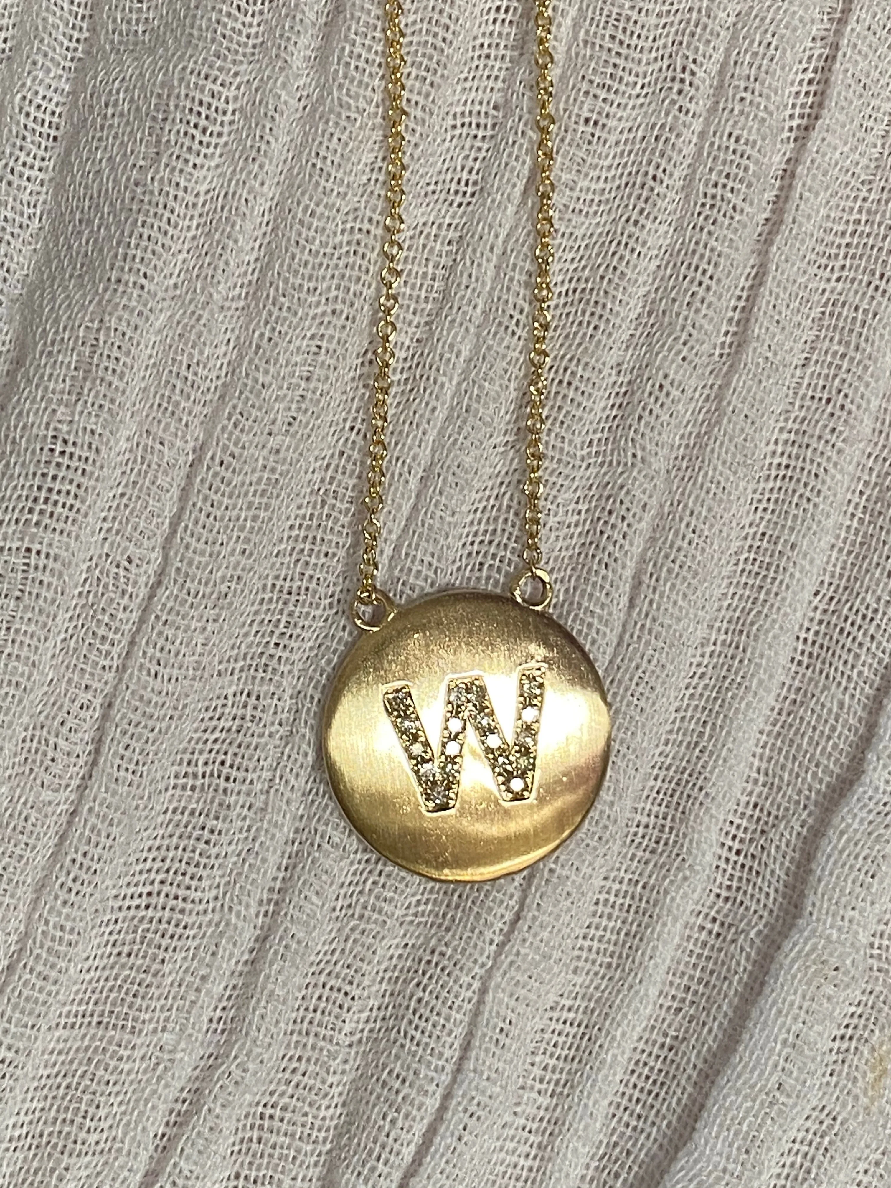 Diamond letter set in 14k matte gold disk necklace